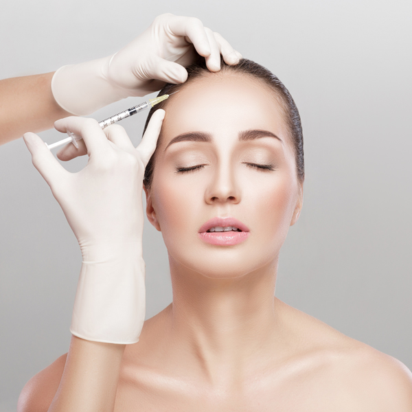 Cosmetic been injected in woman's head.