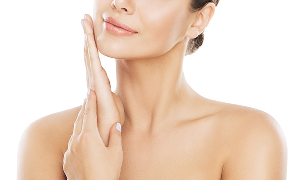 young woman touching face